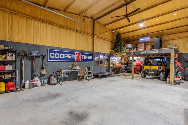 garage with ceiling fan and a workshop area