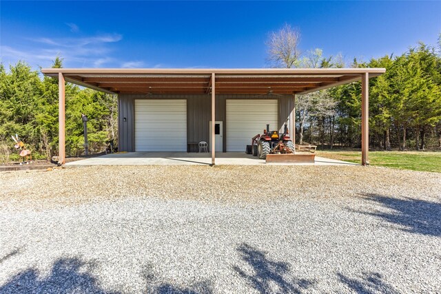 detached garage with concrete driveway
