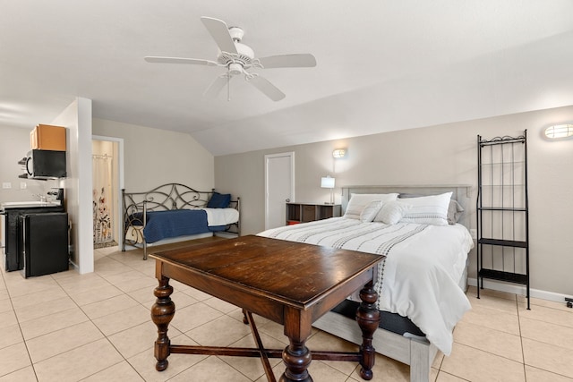 bedroom featuring a ceiling fan, light tile patterned flooring, and vaulted ceiling