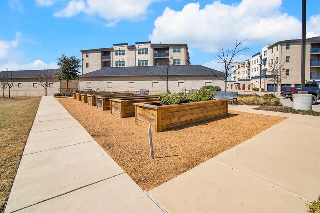 surrounding community with a residential view and a garden