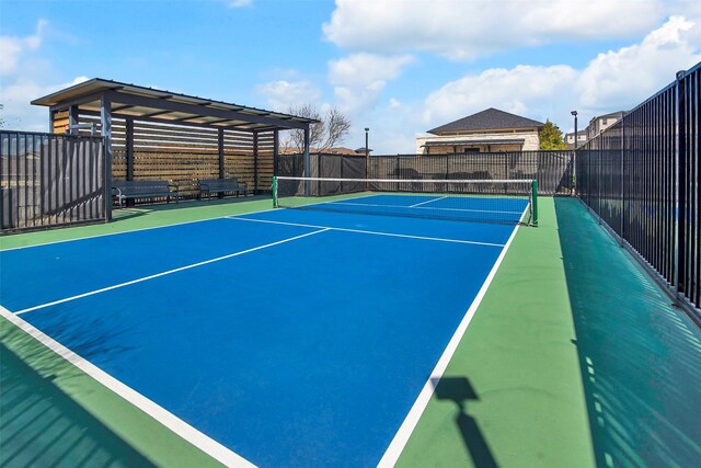 view of sport court with fence