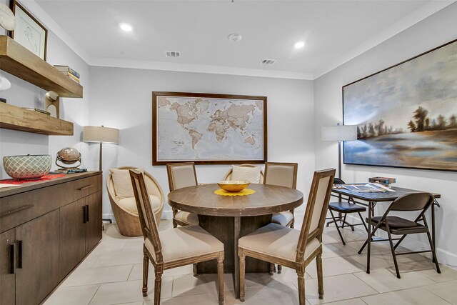 dining area with visible vents, ornamental molding, and light tile patterned floors