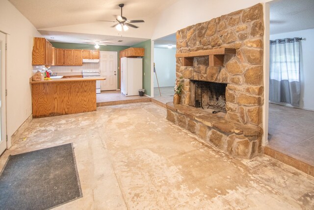 unfurnished living room featuring a stone fireplace, ceiling fan, and vaulted ceiling