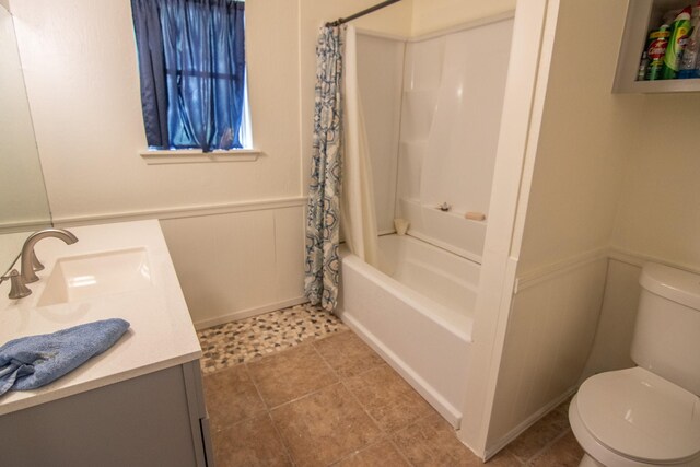 full bathroom with vanity, shower / bathtub combination with curtain, tile patterned flooring, and toilet