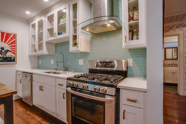 1635 Taft St, Dallas, TX 75208 - kitchen with a sink, stainless steel appliances, wall chimney range hood, dark wood finished floors, and light countertops
