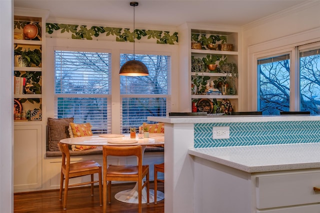 1635 Taft St, Dallas, TX 75208 - interior space featuring wood finished floors, crown molding, plenty of natural light, decorative light fixtures, and built in shelves