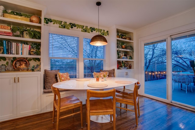 1635 Taft St, Dallas, TX 75208 - dining area with crown molding, dark wood-style floors, and built in features