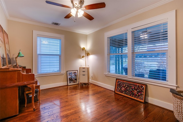 1635 Taft St, Dallas, TX 75208 - living area featuring wood finished floors, visible vents, crown molding, a ceiling fan, and baseboards