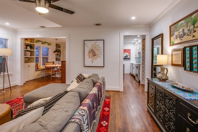 1635 Taft St, Dallas, TX 75208 - living area featuring a ceiling fan, recessed lighting, visible vents, crown molding, and wood finished floors