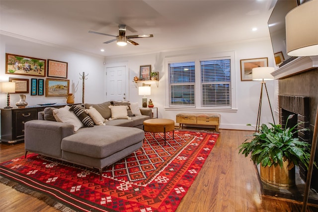1635 Taft St, Dallas, TX 75208 - living room with wood finished floors, a ceiling fan, a brick fireplace, ornamental molding, and recessed lighting