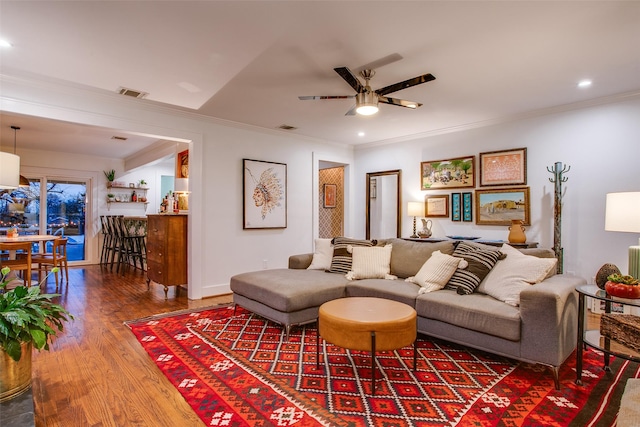 1635 Taft St, Dallas, TX 75208 - living room featuring a ceiling fan, visible vents, crown molding, and wood finished floors