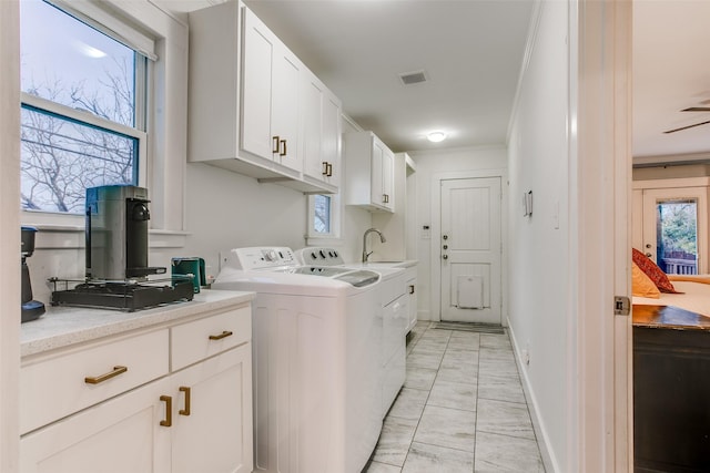 1635 Taft St, Dallas, TX 75208 - laundry room featuring cabinet space, washing machine and clothes dryer, visible vents, and a healthy amount of sunlight