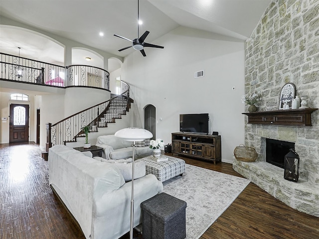 living room with stairway, high vaulted ceiling, a ceiling fan, and visible vents