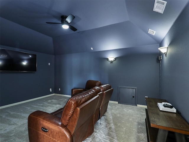 carpeted cinema room with visible vents, a ceiling fan, baseboards, and lofted ceiling