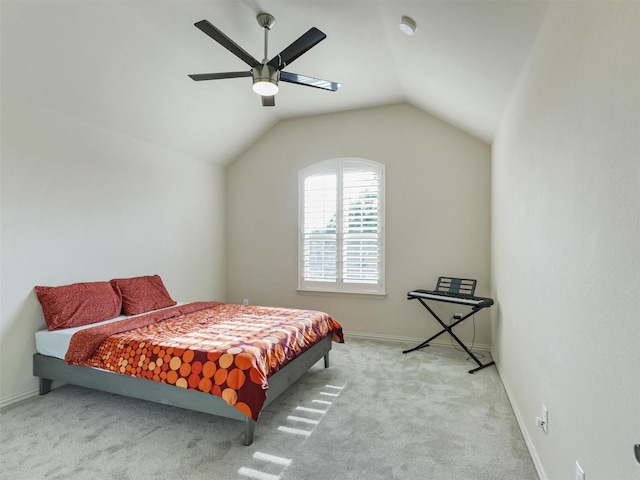 bedroom with carpet floors, baseboards, a ceiling fan, and vaulted ceiling