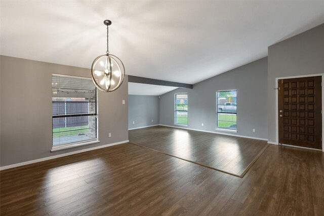interior space with baseboards, dark wood finished floors, an inviting chandelier, and lofted ceiling