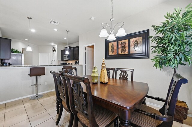 dining space with visible vents, baseboards, a chandelier, recessed lighting, and light tile patterned flooring