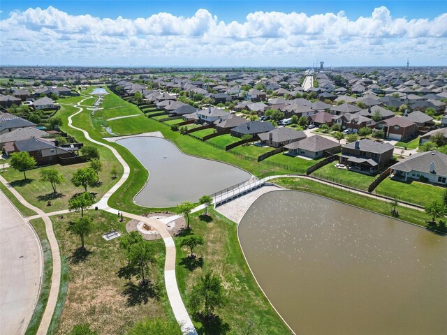 aerial view featuring a residential view and a water view
