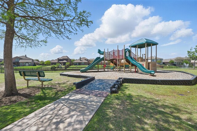 community playground with fence and a yard