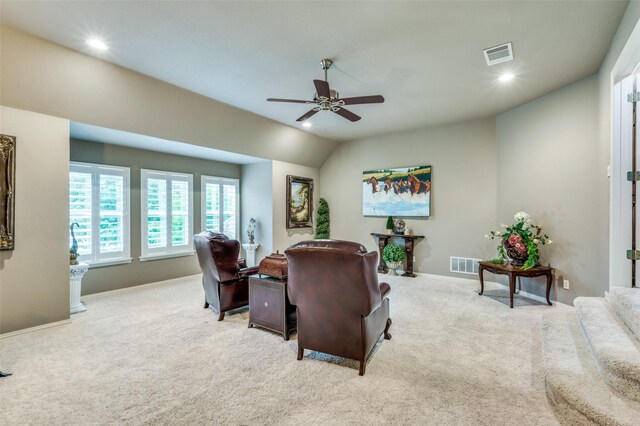 office area with visible vents, ceiling fan, and light colored carpet