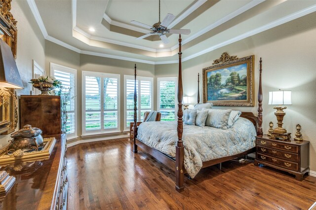 bedroom with crown molding, baseboards, ceiling fan, and wood finished floors