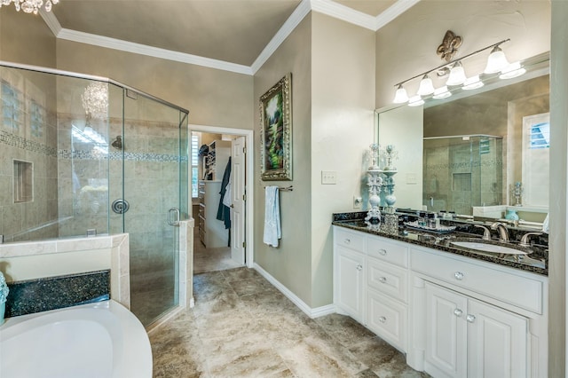 bathroom with vanity, ornamental molding, and a stall shower