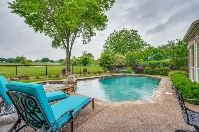 view of pool featuring a fenced in pool, a patio area, fence, and a yard