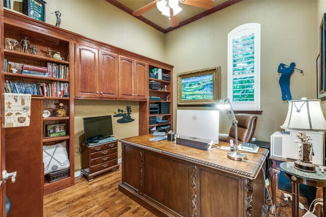 home office featuring crown molding, ceiling fan, and light wood finished floors