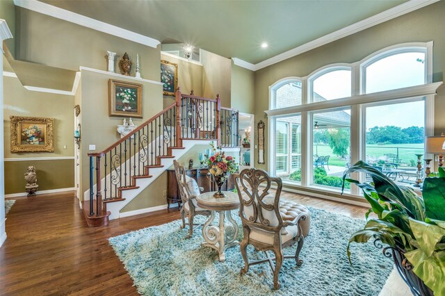 dining room with ornamental molding, stairs, wood finished floors, baseboards, and recessed lighting