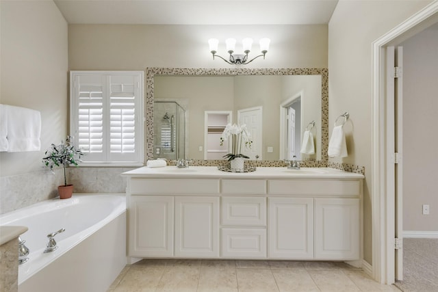 full bathroom with double vanity, a sink, a bath, and a stall shower