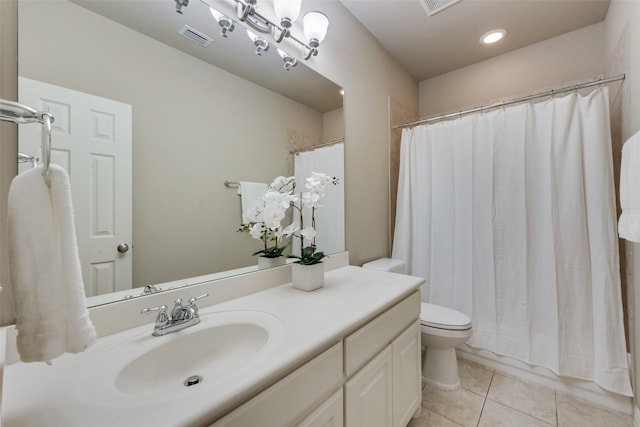 bathroom with vanity, tile patterned flooring, toilet, and visible vents