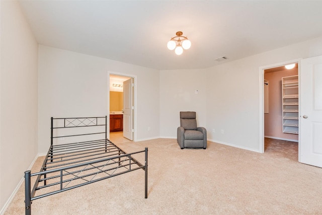 850 Levi Ln, Forney, TX 75126 - unfurnished bedroom featuring light colored carpet, baseboards, a walk in closet, and visible vents