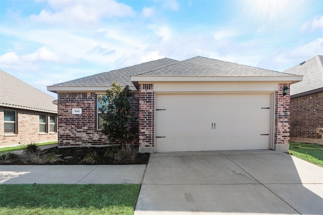 850 Levi Ln, Forney, TX 75126 - ranch-style home featuring brick siding, an attached garage, driveway, and roof with shingles