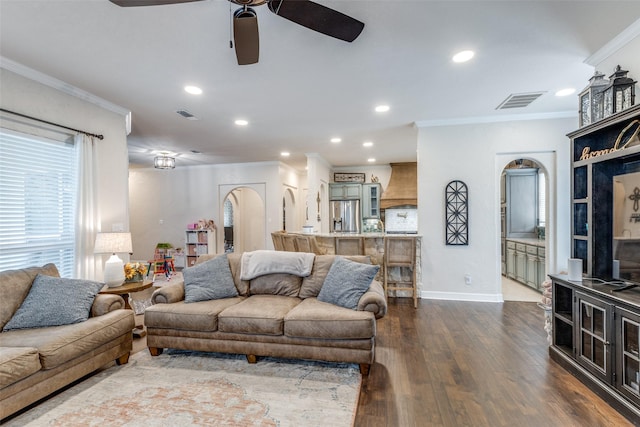 living area featuring ceiling fan, dark wood-style flooring, visible vents, crown molding, and recessed lighting