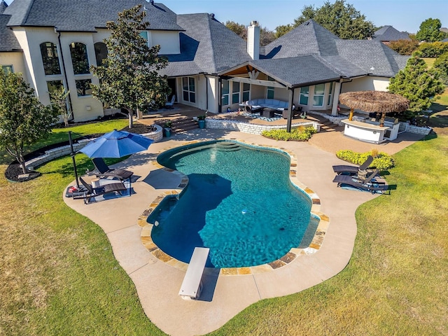 outdoor pool featuring a yard, an outdoor living space, area for grilling, and a patio area