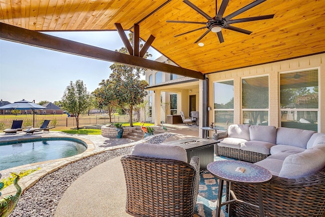 view of patio / terrace with a fenced in pool, ceiling fan, outdoor lounge area, and fence