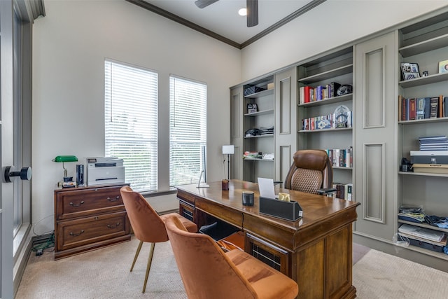 office space featuring crown molding, ceiling fan, and light colored carpet
