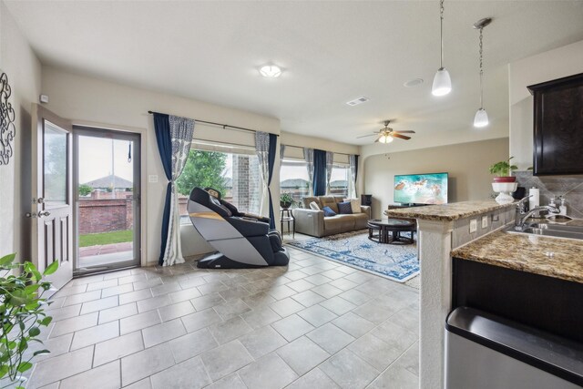 living room with visible vents and ceiling fan