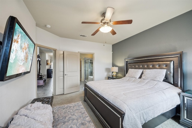 bedroom featuring carpet flooring, ceiling fan, visible vents, and ensuite bathroom