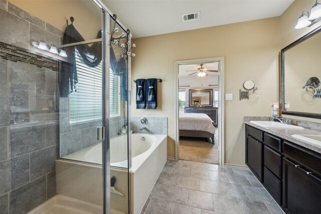 ensuite bathroom with a sink, visible vents, a shower stall, and ensuite bathroom