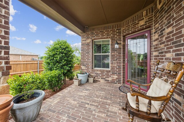 view of patio / terrace featuring fence