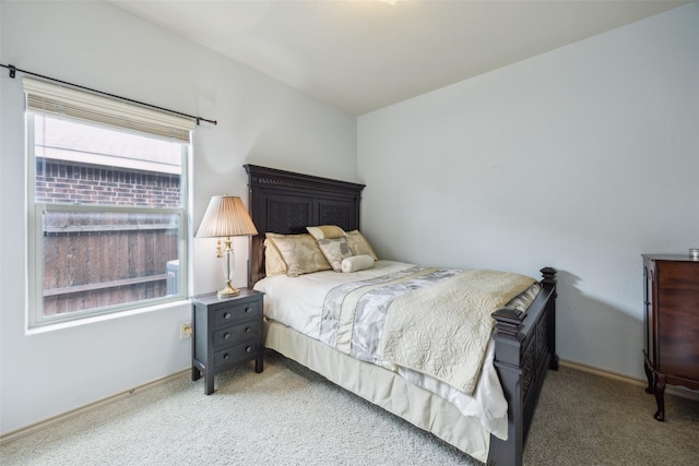 bedroom featuring baseboards and carpet flooring