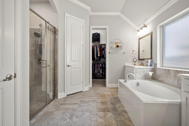 bathroom with vanity, ornamental molding, and a stall shower