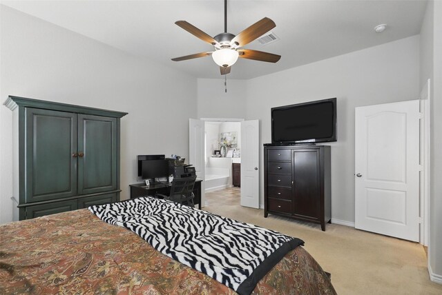 bedroom featuring baseboards, a ceiling fan, connected bathroom, and light colored carpet