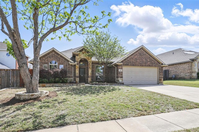 ranch-style house featuring brick siding, driveway, a front yard, and a garage