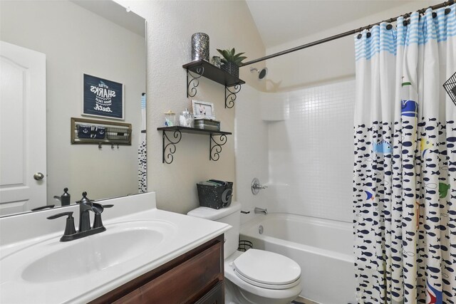 bathroom with shower / bath combo with shower curtain, toilet, and vanity