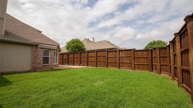 view of yard featuring a fenced backyard and a patio