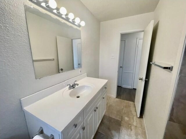 bathroom featuring tile patterned floors and vanity