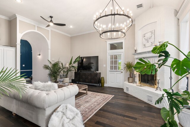 living room featuring visible vents, arched walkways, wood finished floors, ceiling fan with notable chandelier, and recessed lighting