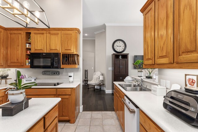 kitchen with crown molding, black microwave, a sink, dishwasher, and light countertops